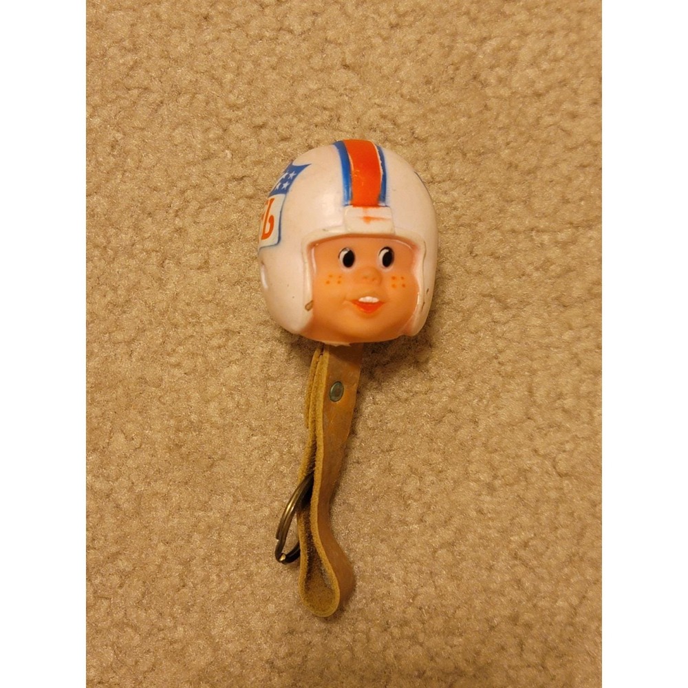 Vintage 1976 NFL Properties Key Chain with a Head Design, a Rare Item.